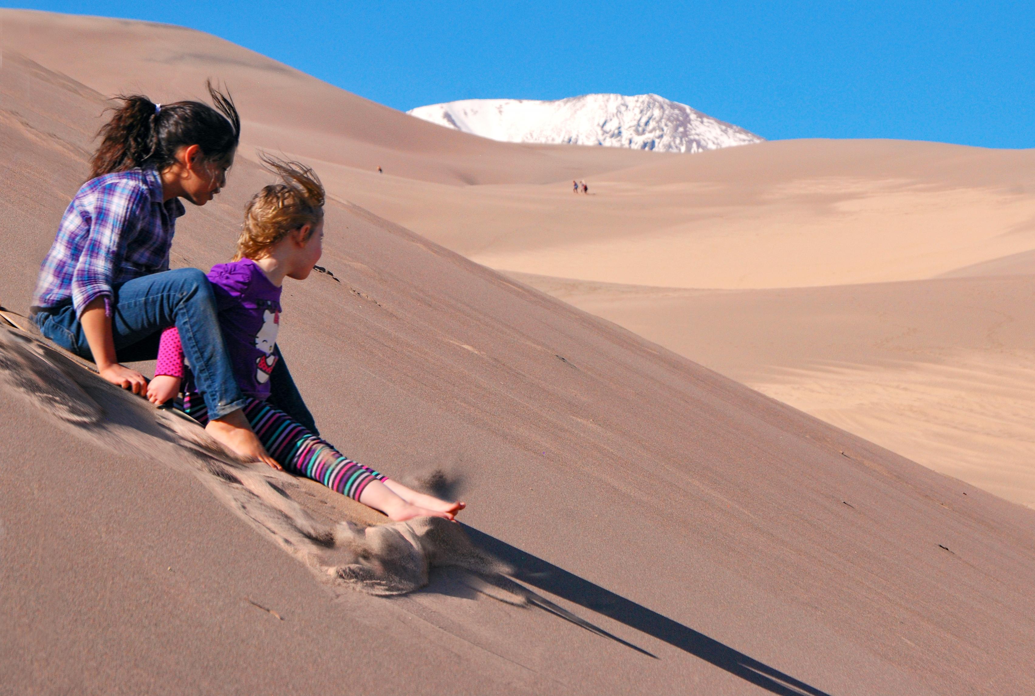 Sandboarding and Sand Sledding